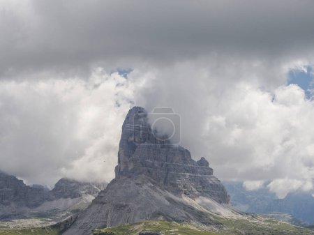 Photo for Helicopter used for rescue operations on Tre Cime di Lavaredo in Dolomites, Italy on cloudy day - Royalty Free Image