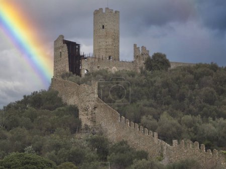 Photo for The Ursino mountain castle in noli medieval village liguria italy with rainbow - Royalty Free Image
