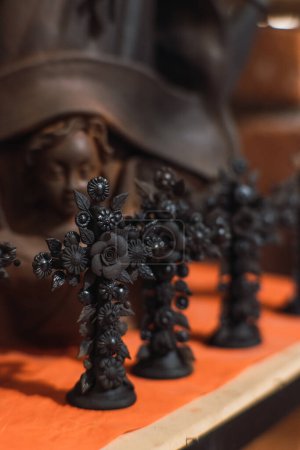 Dark clay crosses, traditional Mexican crafts.