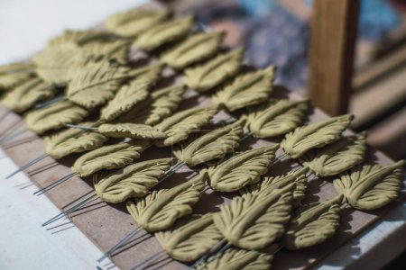 Tree leaves made of clay for a traditional arbol de la vida, Mexican crafts.