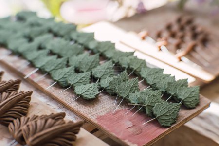 Clay leaves, pieces to make a traditional tree of life, typical Mexican crafts.