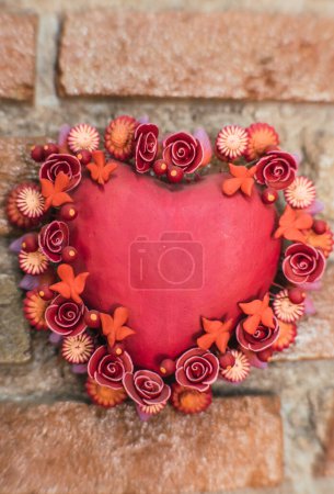 Red clay heart, traditional Mexican crafts.