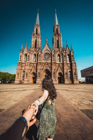 POV photography of a couple of the Cathedral "Diocesan Sanctuary of Our Lady of Guadalupe" in Zamora Michoacan, shows Gothic style architecture.