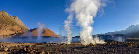 Photo for Geyser at the El Tatio Geyser Field at 4512m (14765ft) high in Andes Mountains in the Atacama Desert, northern Chile. The Geysers are most active just before dawn when the air temperature can be as low as -15C - Royalty Free Image