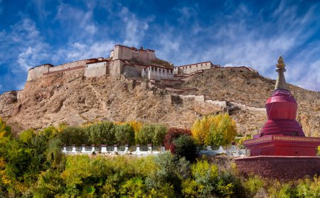 Photo for Gyantse Fort in the small town of town of Gyantse in Tibet, China. On of the best preserved Dzongs (fortified monasteries) in Tibet. The present structure dates from 1268CE although a fortress has been on the site since 838CE - Royalty Free Image