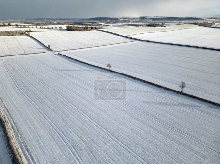 Photo for Aerial view of a snow covered agricultural landscape in North Yorkshire in the United Kingdom. - Royalty Free Image