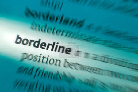 Borderline - only just acceptable in quality or as belonging to a category. A boundary separating two countries or a division between two distinct or opposite things.