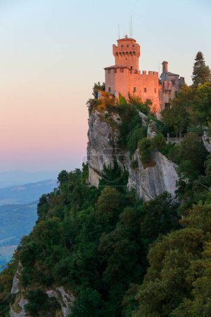 Late afternoon sunlight on the Fortress of Guaita on Mount Titano in San Marino. The Republic of San Marino is an enclaved microstate surrounded by Italy.