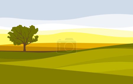 Idyllic landscape. Countryside. A lone tree among the green fields.