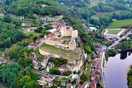 View of Chateau de Beynac in Beynac et Cazenac at sunrise as viewed from a hot air balloon following a dawn take off
