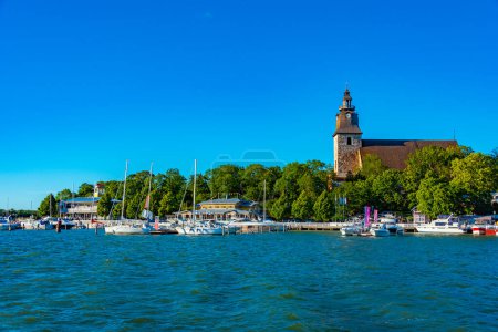 Photo for Naantali church viewed over marina in Finland. - Royalty Free Image