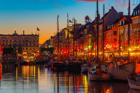 Sunset view of old Nyhavn port  in the central Copenhagen, Denmark..