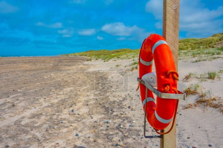 Photo for Safety buoy Tornby beach in Denmark. - Royalty Free Image