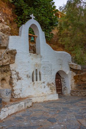 Photo for Small chapel at Voulismeni lake at Greek town Agios Nikolaos at Crete island. - Royalty Free Image