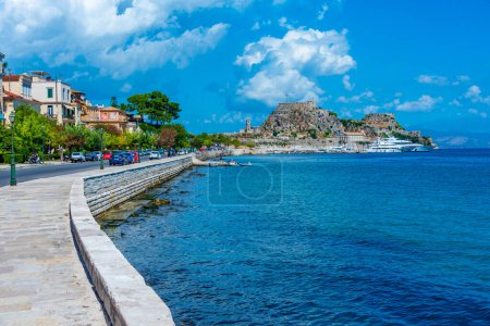 Photo for View of the Palaio Frourio at the far end of waterfront promenade at Greek island Corfu. - Royalty Free Image