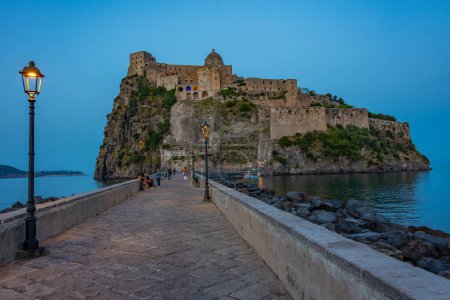 Photo for Sunset view of Castello Aragonese off the coast of Italian island Ischia. - Royalty Free Image