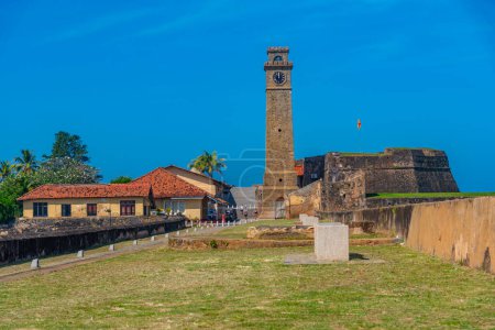 Photo for Galle fort clock tower looking over military bastions, Sri Lanka. - Royalty Free Image