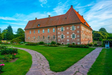 Téléchargez les photos : Coucher de soleil sur le château de Krapperup en Suède. - en image libre de droit