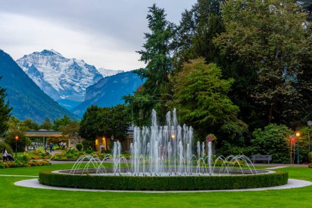 Photo for Sunset view of fountain at the casino Interlaken in Switzerland. - Royalty Free Image