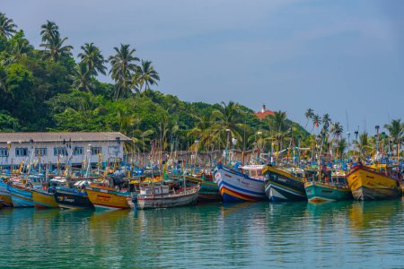 Photo for Mirissa, Sri Lanka, January 23, 2022: Fishing boats at the port of Mirissa, Sri Lanka. - Royalty Free Image