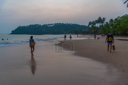 Photo for Mirissa, Sri Lanka, January 22, 2022: Mirissa beach during sunset at Sri Lanka. - Royalty Free Image