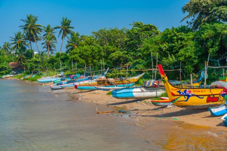 Photo for Mirissa, Sri Lanka, January 22, 2022: Fishing boats at the port of Mirissa, Sri Lanka. - Royalty Free Image
