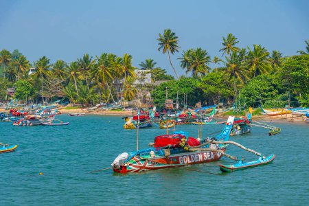 Photo for Mirissa, Sri Lanka, January 22, 2022: Fishing boats at the port of Mirissa, Sri Lanka. - Royalty Free Image