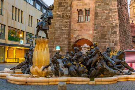 Photo for Nurnberg, Germany, August 11, 2022: Sunrise view of ehekarussell fountain in Nurnberg, Germany.. - Royalty Free Image