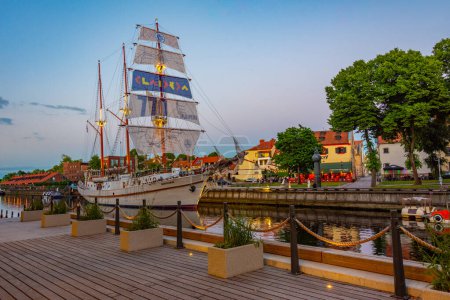 Photo for Klaipeda, Lithuania, July 3, 2022: Sunset view of historical sailboat Meridian in lithuanian town Klaipeda. - Royalty Free Image