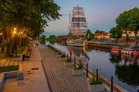 Photo for Klaipeda, Lithuania, July 3, 2022: Sunset view of historical sailboat Meridian in lithuanian town Klaipeda. - Royalty Free Image