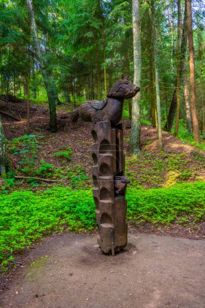 Photo for Juodkrante, Lithuania, July 4, 2022: Wooden sculpture at Hill of Witches at Curonian spit in Lithuania. - Royalty Free Image