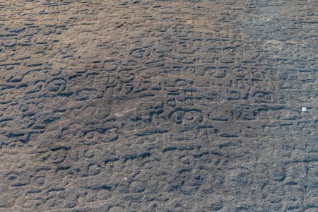 Photo for Kandy, Sri Lanka, February 2, 2022: Rock inscriptions at the Lankathilake temple near Kandy, Sri Lanka. - Royalty Free Image
