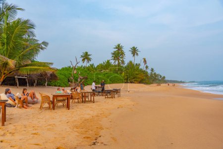Photo for Tangalle, Sri Lanka, January 23, 2022: Beach restaurant at Medaketyia beach at Sri Lanka. - Royalty Free Image