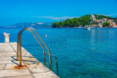 Metal steps leading to the Adriatic sea at Cavtat, Croatia magic mug #712834728