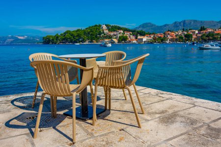 Cafe table and chairs at Croatian seaside at Cavtat magic mug #712834820