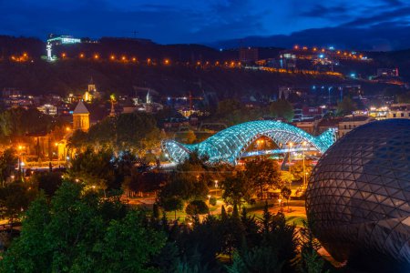 Night view of the Bridge of Peace in Tbilisi, Georgia