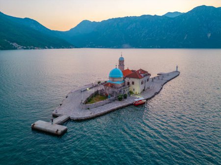 Sunset aerial view of Church of Our Lady of Skrpjela near Perast in Montenegro