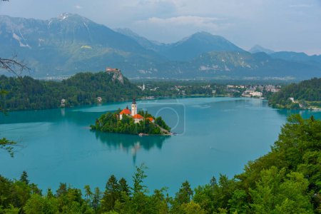 Assumption of Maria church and Bled Castle at lake Bled in Slovenia