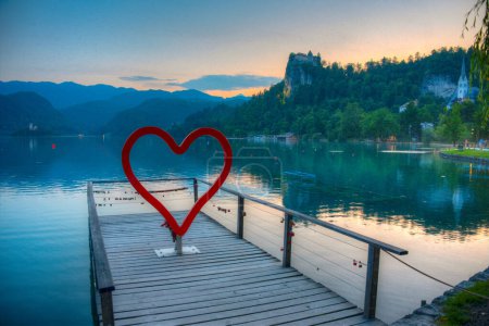 Sunset view over a romantic pier at lake Bled in Slovenia
