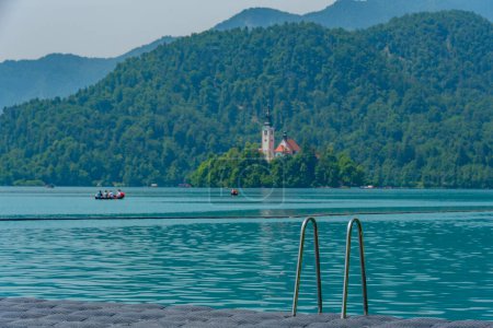 Assumption of Maria church at lake Bled viewed from the castle bathing area in Slovenia