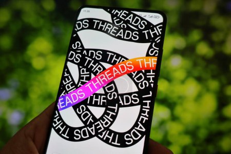 Photo for In this photo illustration, Threads logo seen displayed on a smartphone. Meta will release a social media app called "Threads", which will be a rival to Twitter. "Threads" is Instagram's text-based conversation app. - Royalty Free Image