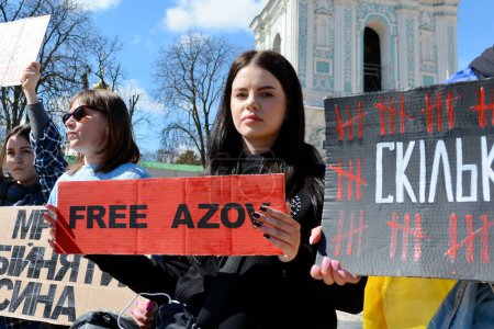 Photo for People stand with placards during action 'Don't Be Silent. Captivity Kills' on April 07, 2024 in Kyiv, Ukraine. - Royalty Free Image