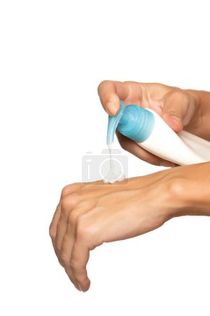 Photo for Woman hands pushing pump plastic body milk bottle on white background with copy space - Royalty Free Image