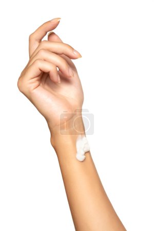 Téléchargez les photos : Close up cropped woman hand perfect skin hand cream isolated on white studio  background. Skin care healthcare procedures concept. Posing with  moisturizer on arm. - en image libre de droit