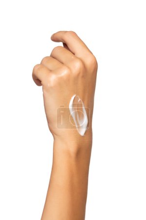 Foto de Close up cropped woman hand perfect skin hand cream isolated on white studio  background. Skin care healthcare procedures concept. Posing with  moisturizer on arm. - Imagen libre de derechos