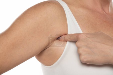 woman touching her skin underarm she problem armpit fat underarm wrinkled skin on a white studio background