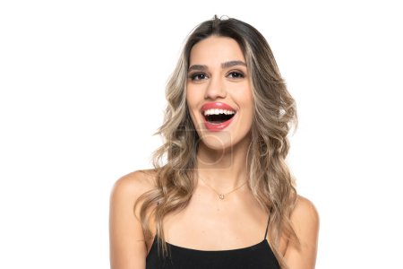 Photo for Beautiful young happy women with makeup and long wavy hair on a white studio background. - Royalty Free Image