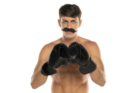Photo for Young shirtless man with moustache and boxing gloves on a white studio background - Royalty Free Image