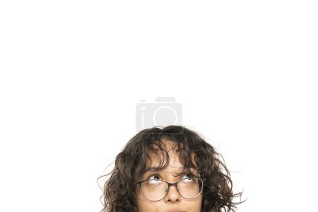 Photo for Closeup portrait headshot cropped face above lips of cute puzzled woman in glasses looking up isolated on white studio wall background with copy space above head. Human face expressions, emotions - Royalty Free Image