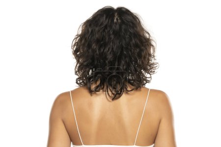 Photo for Back view head shot of beautiful curly dark wavy  hair woman against white studio  background - Royalty Free Image